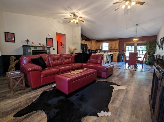 Open living room looking toward the kitchen and dining area